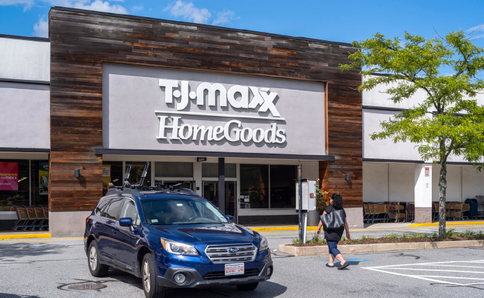 Blue SUV and woman in front of TJ Maxx HomeGoods.