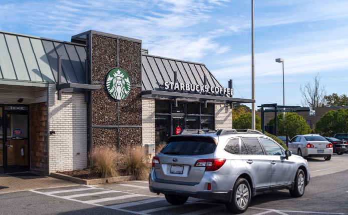 Grey SUV in front of Starbucks Coffee.