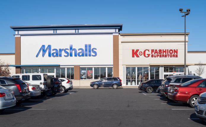 Marshalls and K&G Fashion with rows of parked cars in front.