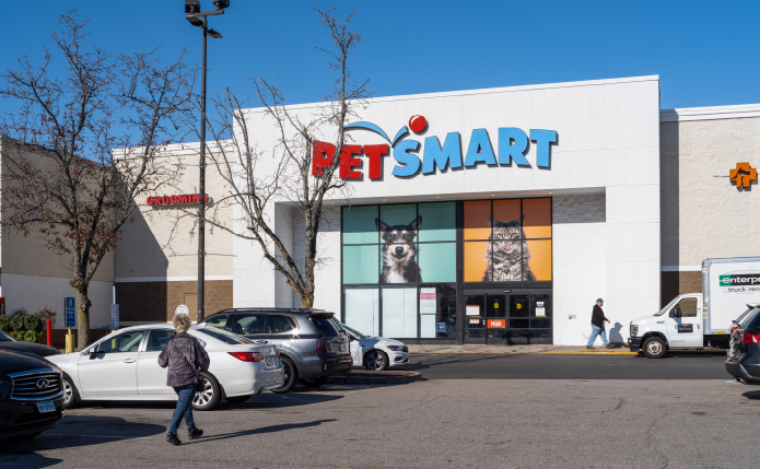 Patron approaches PetSmart through parking lot.