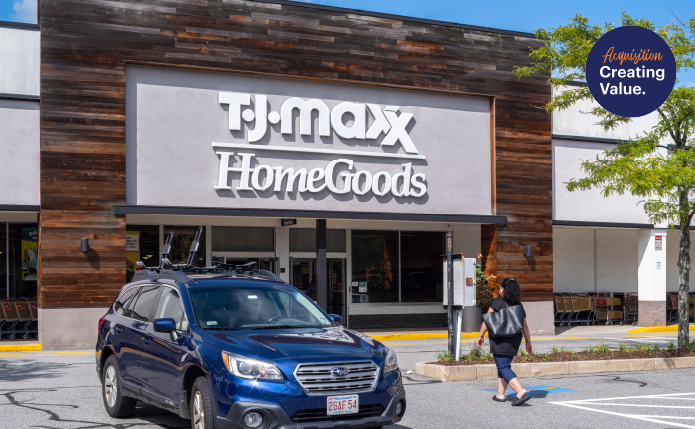 Blue SUV and patron in front of TJ Maxx HomeGoods.