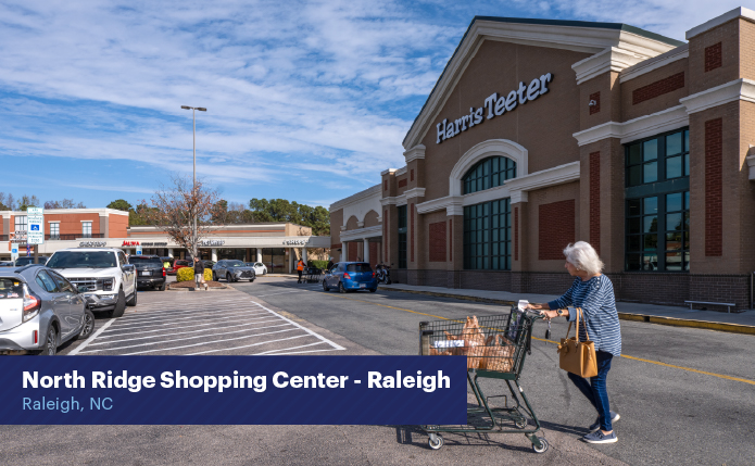 Woman pushing shopping cart in front of Harris Teeter.