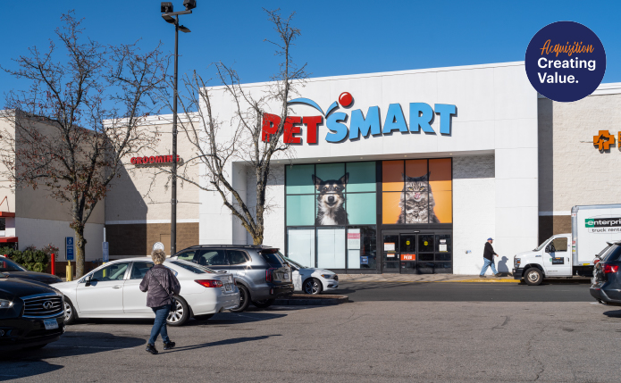 Patron approaches PetSmart through parking lot.