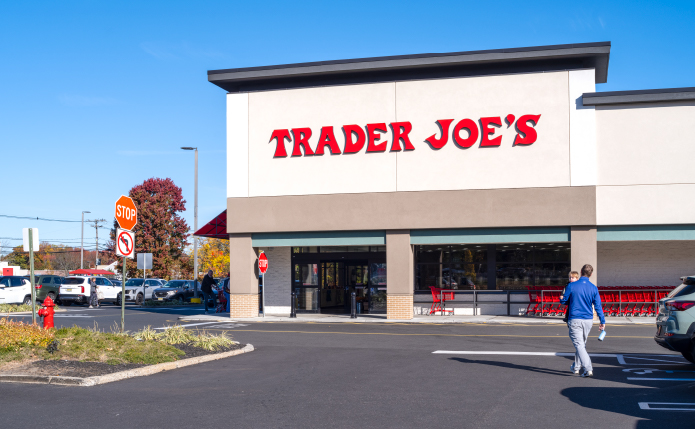 Man with child approaches Trader Joe's.