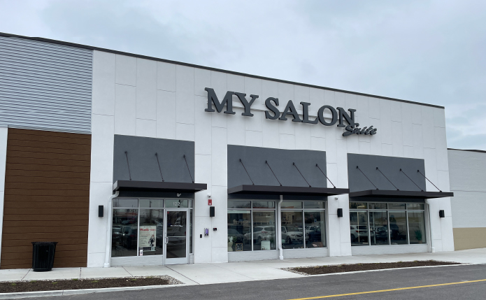 My Salon Suite storefront with grey blue sky above.