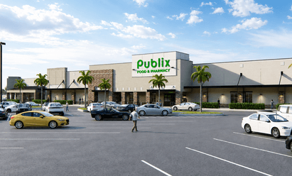 Updated grocery‑anchored retail building at Sunrise Town Center in Sunrise, FL, shown with stone accent columns, wide sidewalks, palm‑lined frontage, and customer vehicles filling the surrounding parking area.