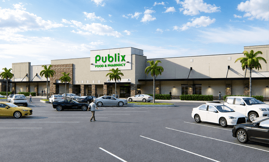 Updated grocery‑anchored retail building at Sunrise Town Center in Sunrise, FL, shown with stone accent columns, wide sidewalks, palm‑lined frontage, and customer vehicles filling the surrounding parking area.