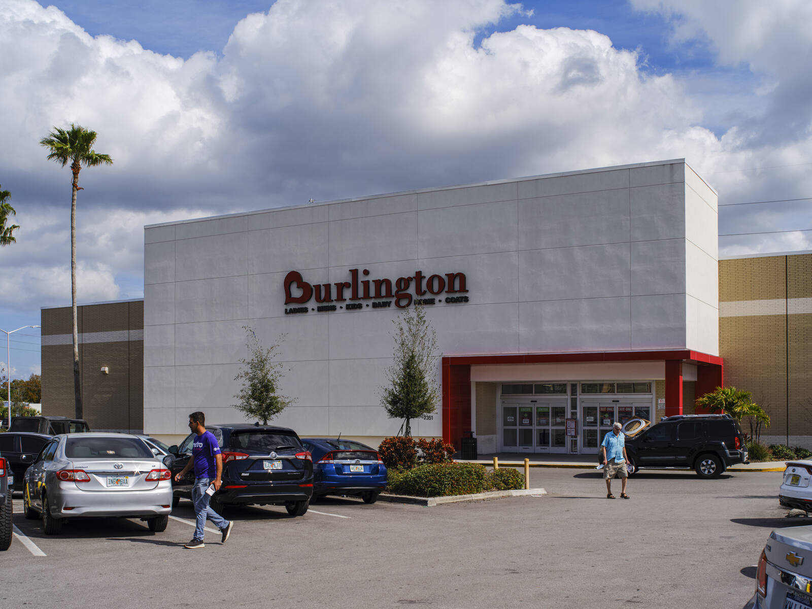 Palm trees in a full parking lot of Burlington at Seminole Plaza shopping center