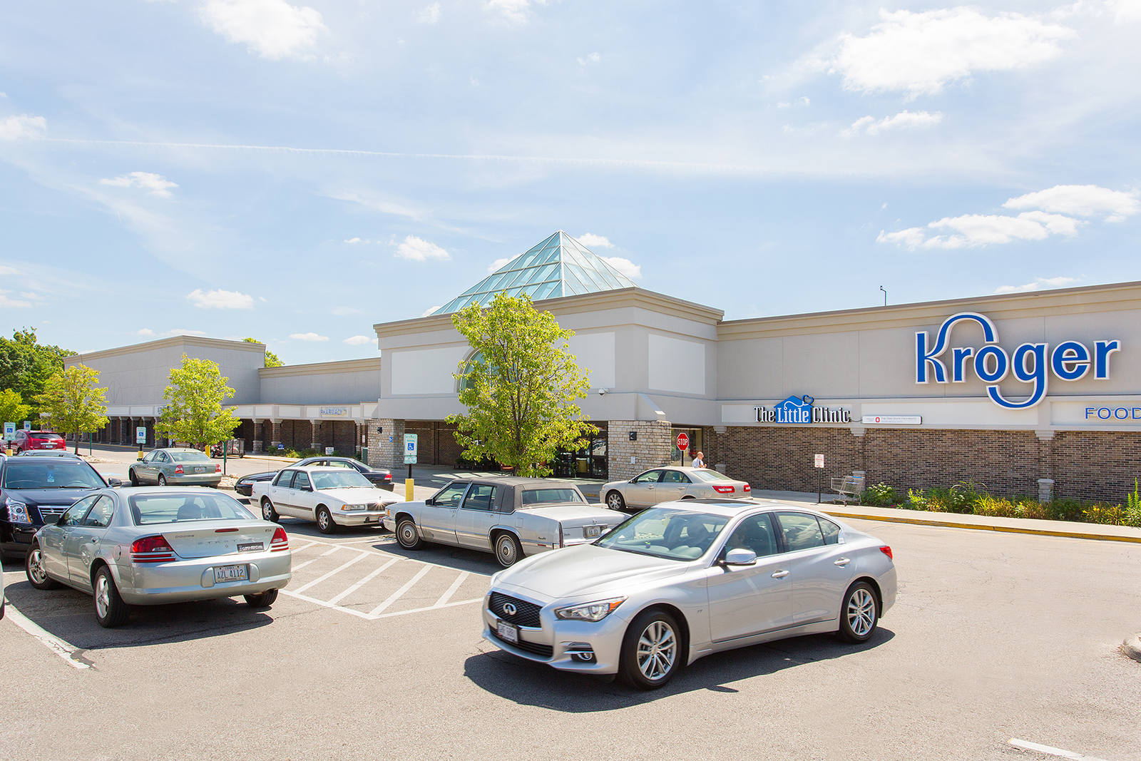 Cars and trees at busy Kroger supermarket at Greentree Shopping Center.