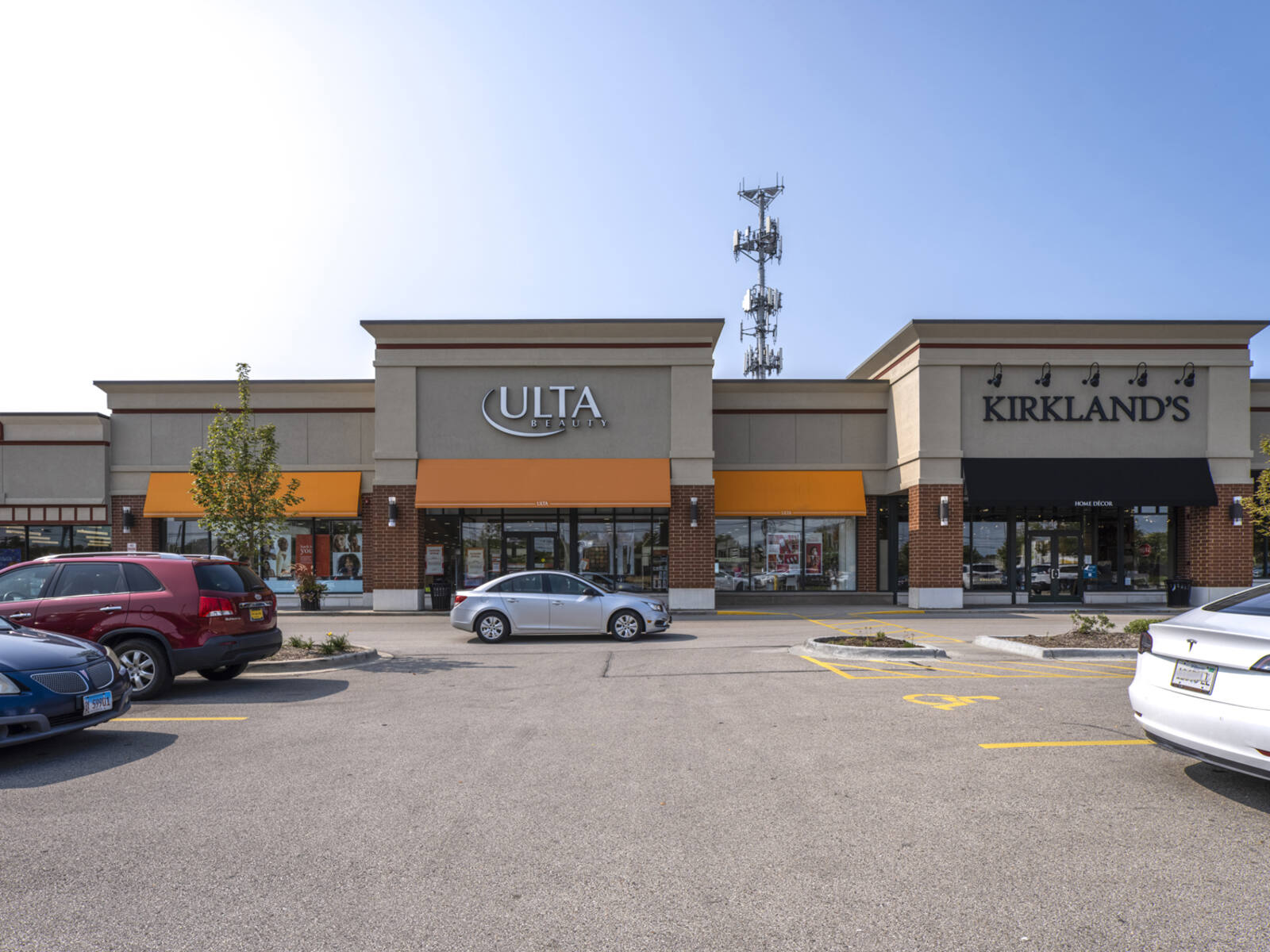 Ulta and Kirkland's store with busy parking lot at front.