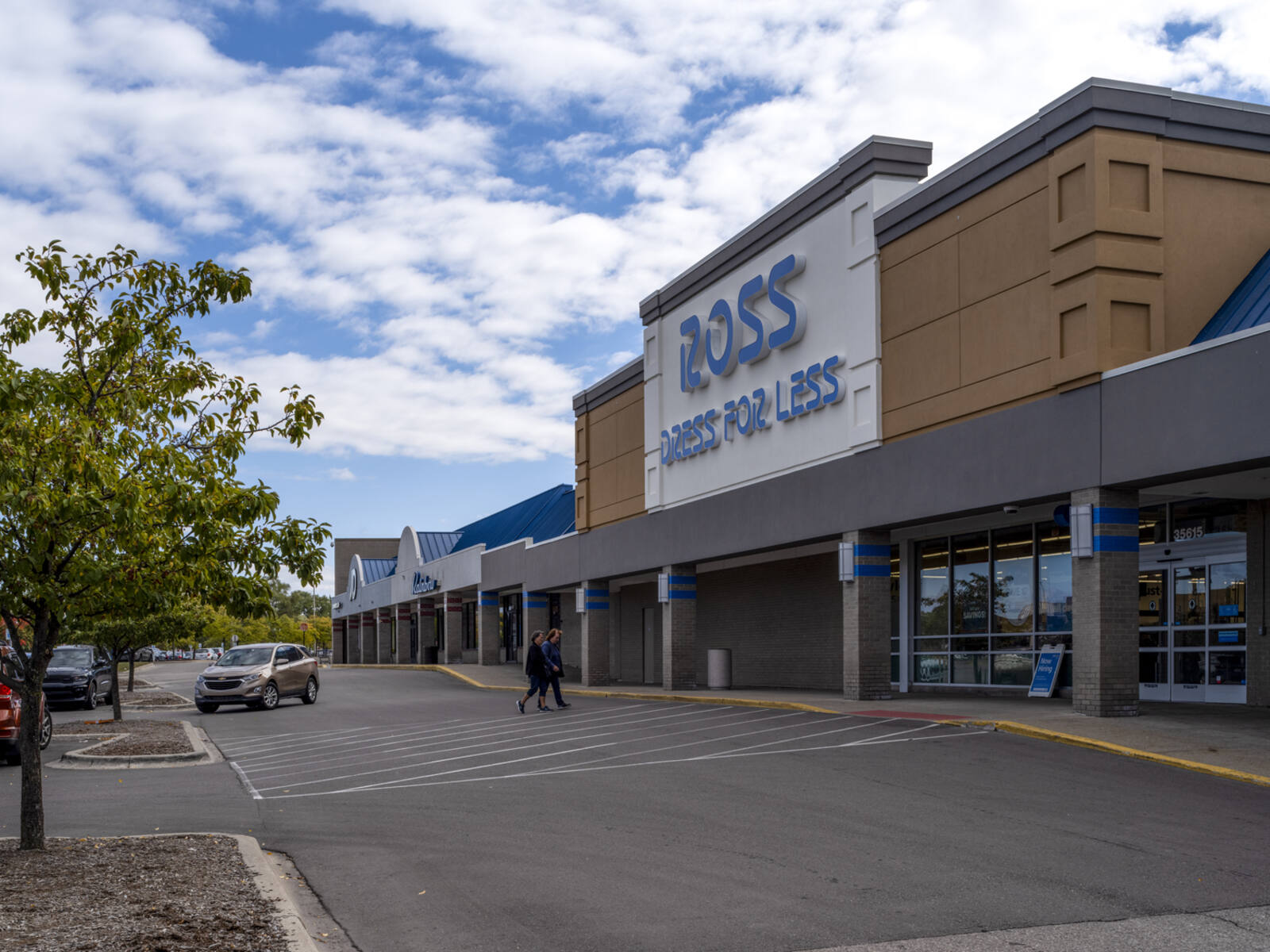 Customers and an SUV in the crosswalk for Ross Dress for Less.