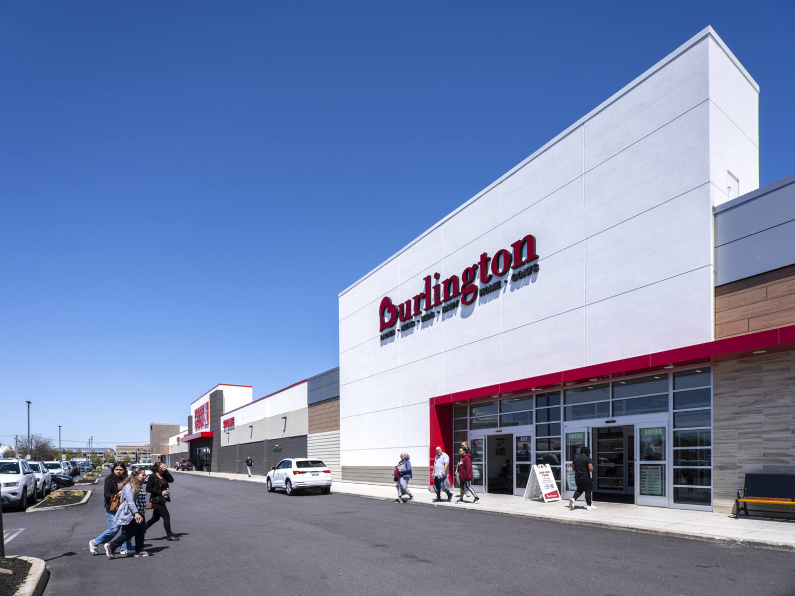 Pedestrians approach Burlington department store at Stewart Plaza.