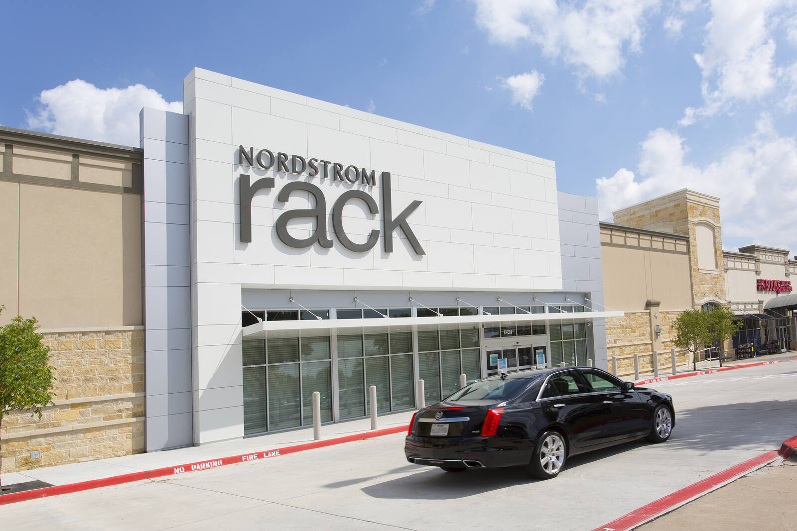 Black car in front of Nordstrom Rack at Preston Ridge Shopping Center