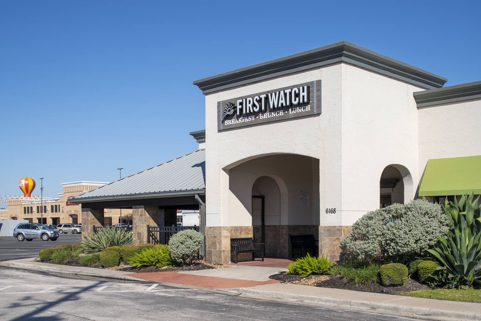 First Watch with shrubs and planters at Hearthstone Corners.