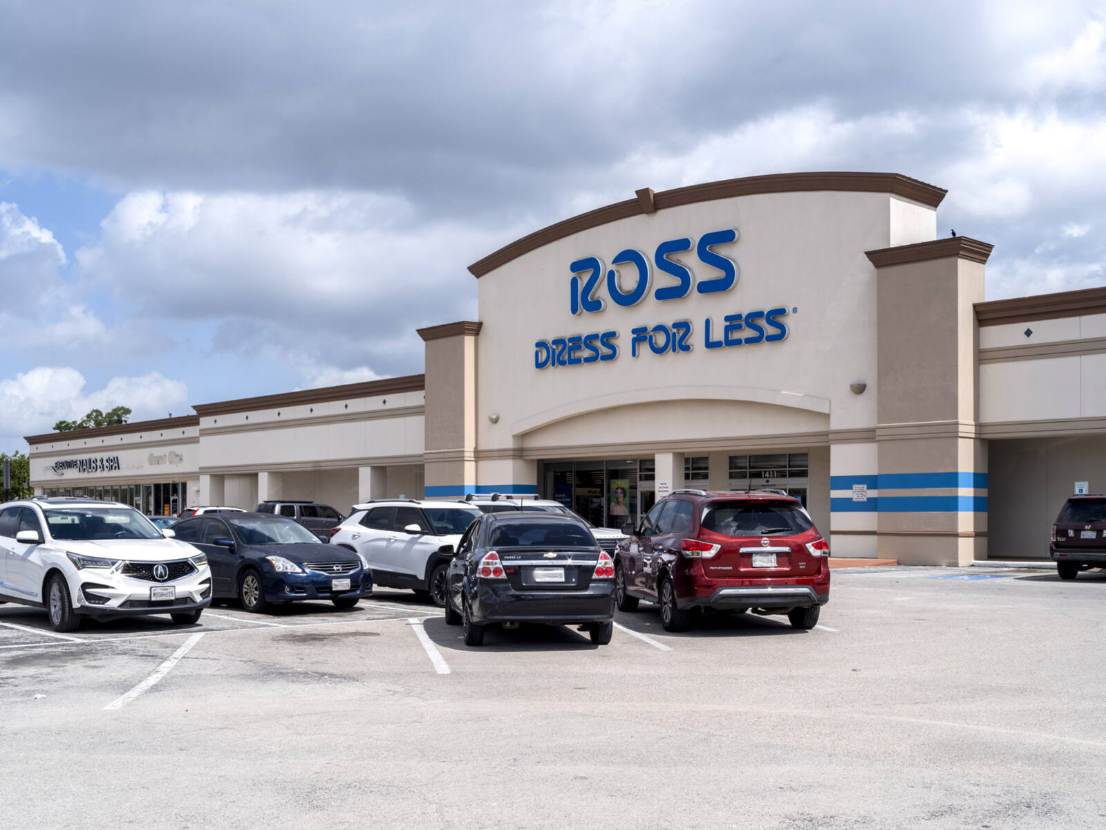 Cars in the lot in front of Ross Dress for Less.