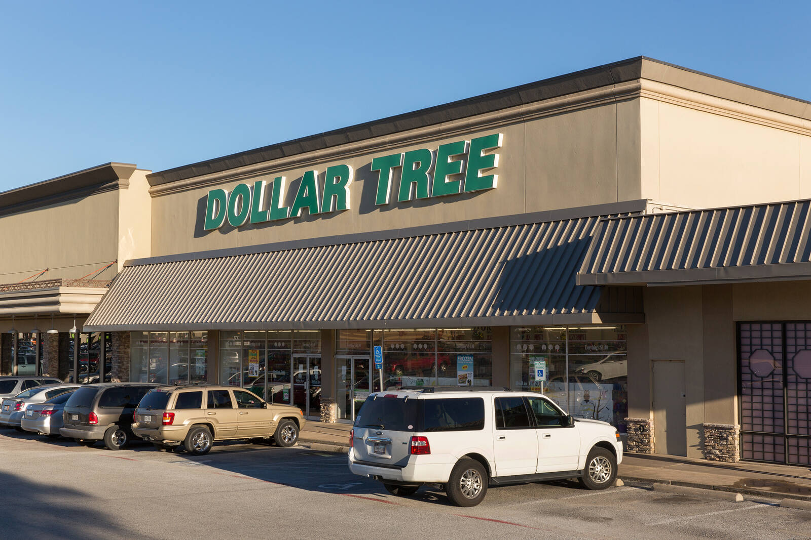 Cars parked along entrance to Dollar Tree in Fort Worth, Texas