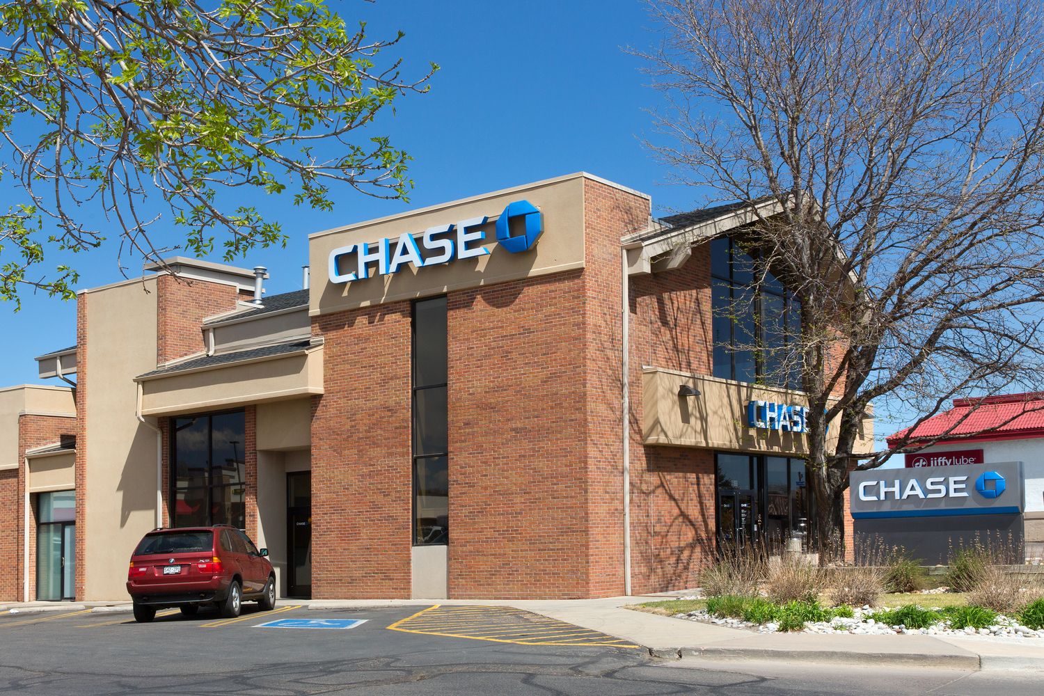 Red SUV pulled up to Chase bank in Arvada Plaza