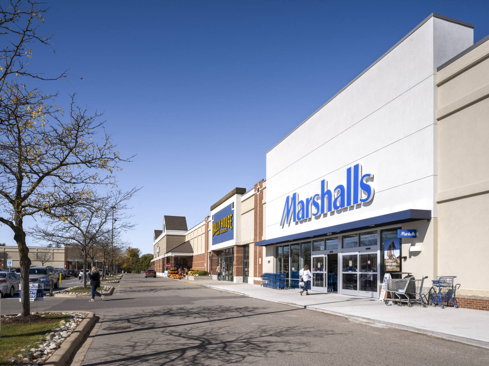 Women entering and exiting Marshalls at Arborland Center.