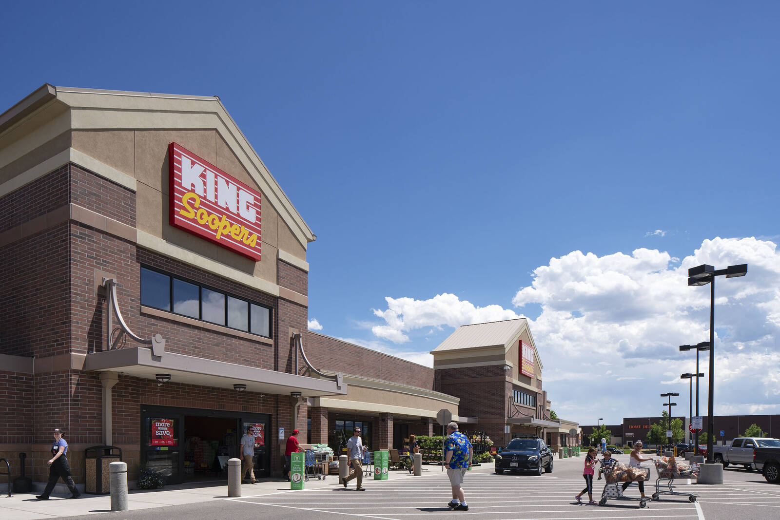 Many customers enter and exit King Soopers supermarket at Englewood, CO.