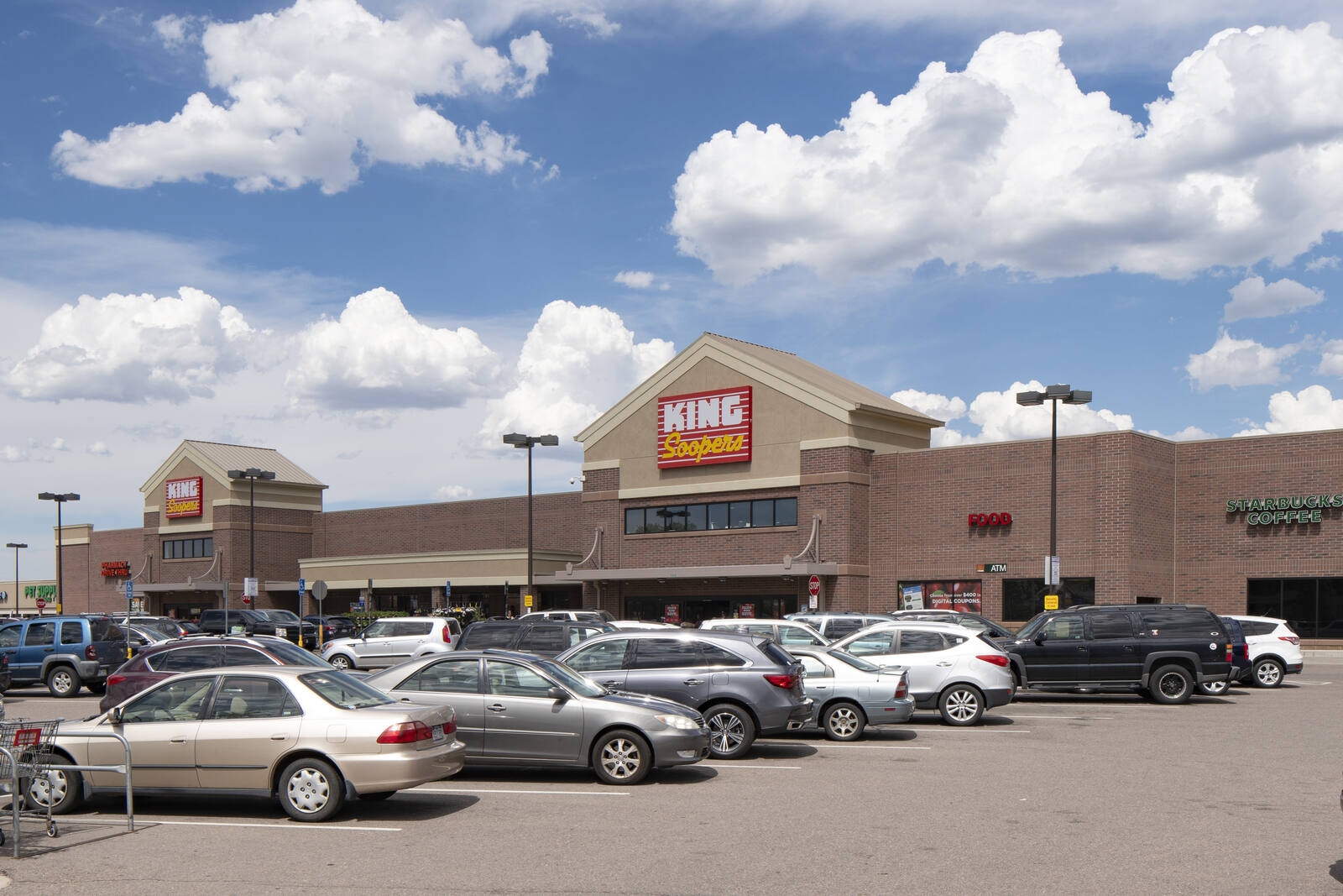 Busy parking lot at King Soopers in Centennial Shopping Center.