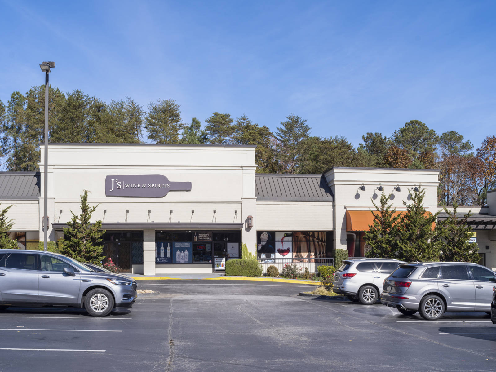 Rows of cars and trees at J's Wines & Spirits in Roswell, GA.