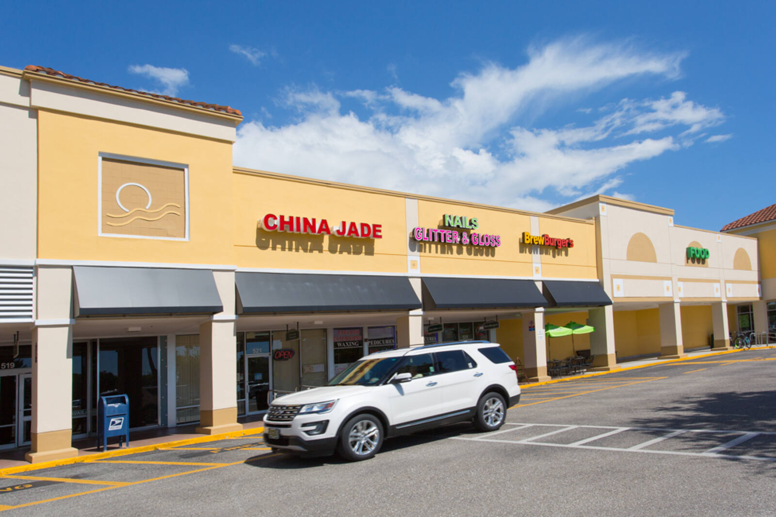 White SUV parked in front of China Jade at Venice Shopping Center