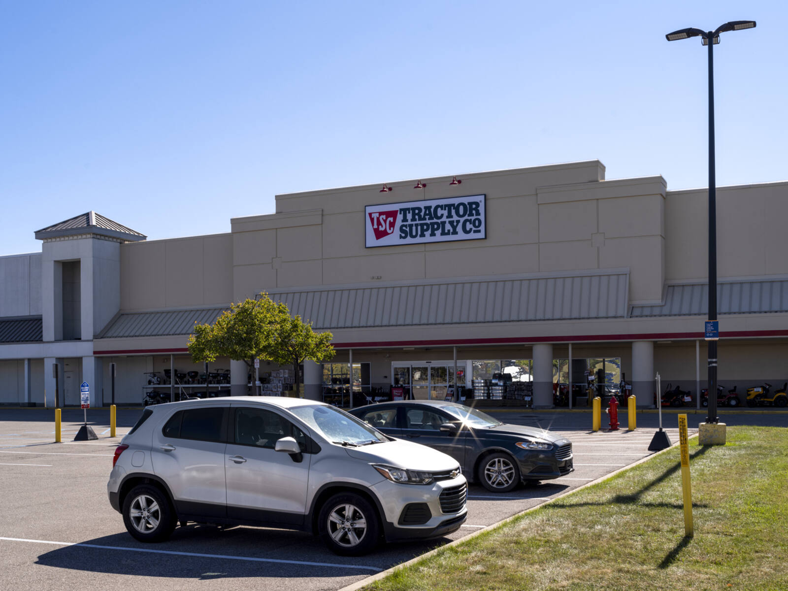 Cars parked in front of Tractor Supply Co.