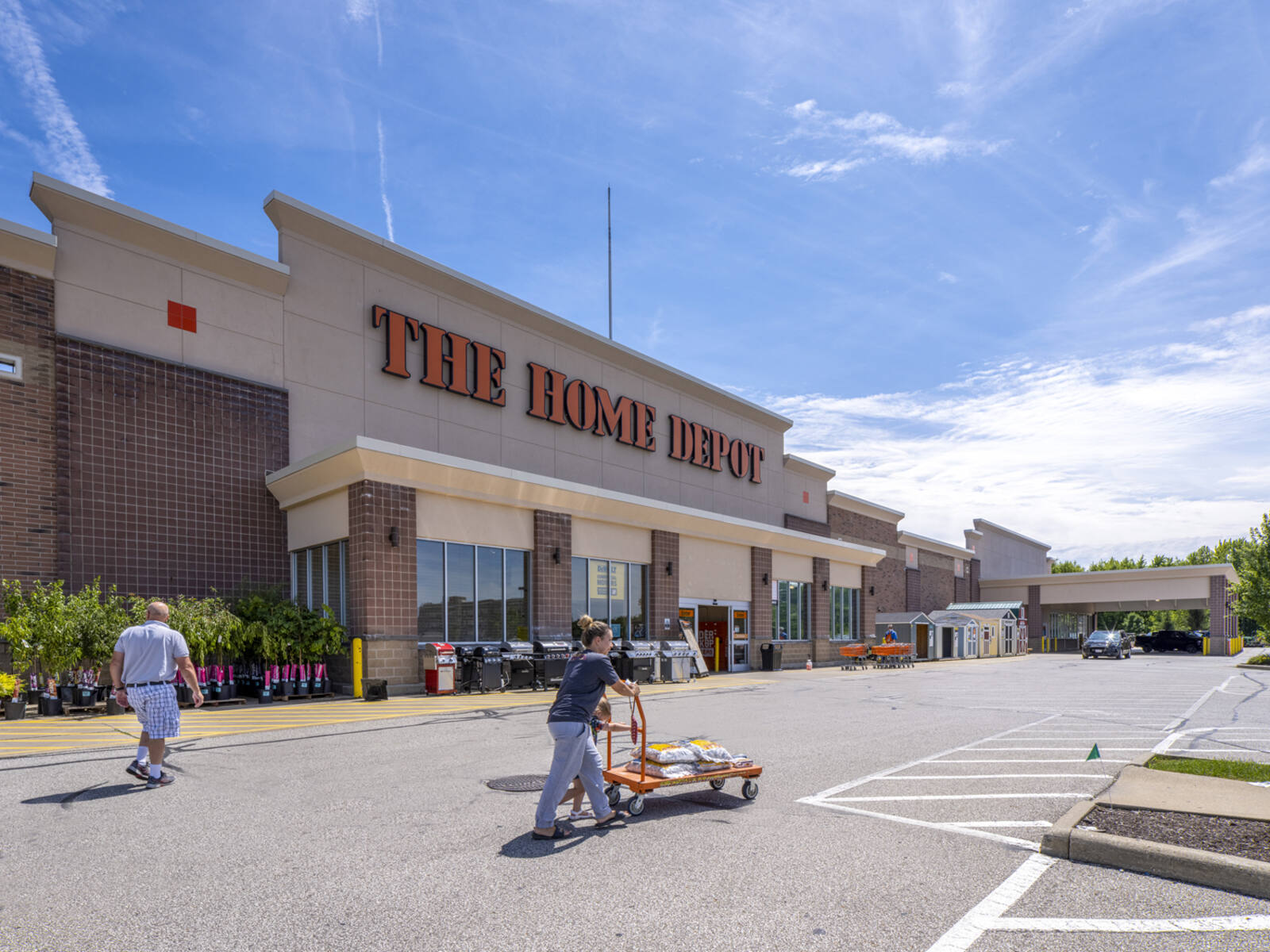 Customers push hardware cart in front of The Home Depot in Brunswick, OH. 