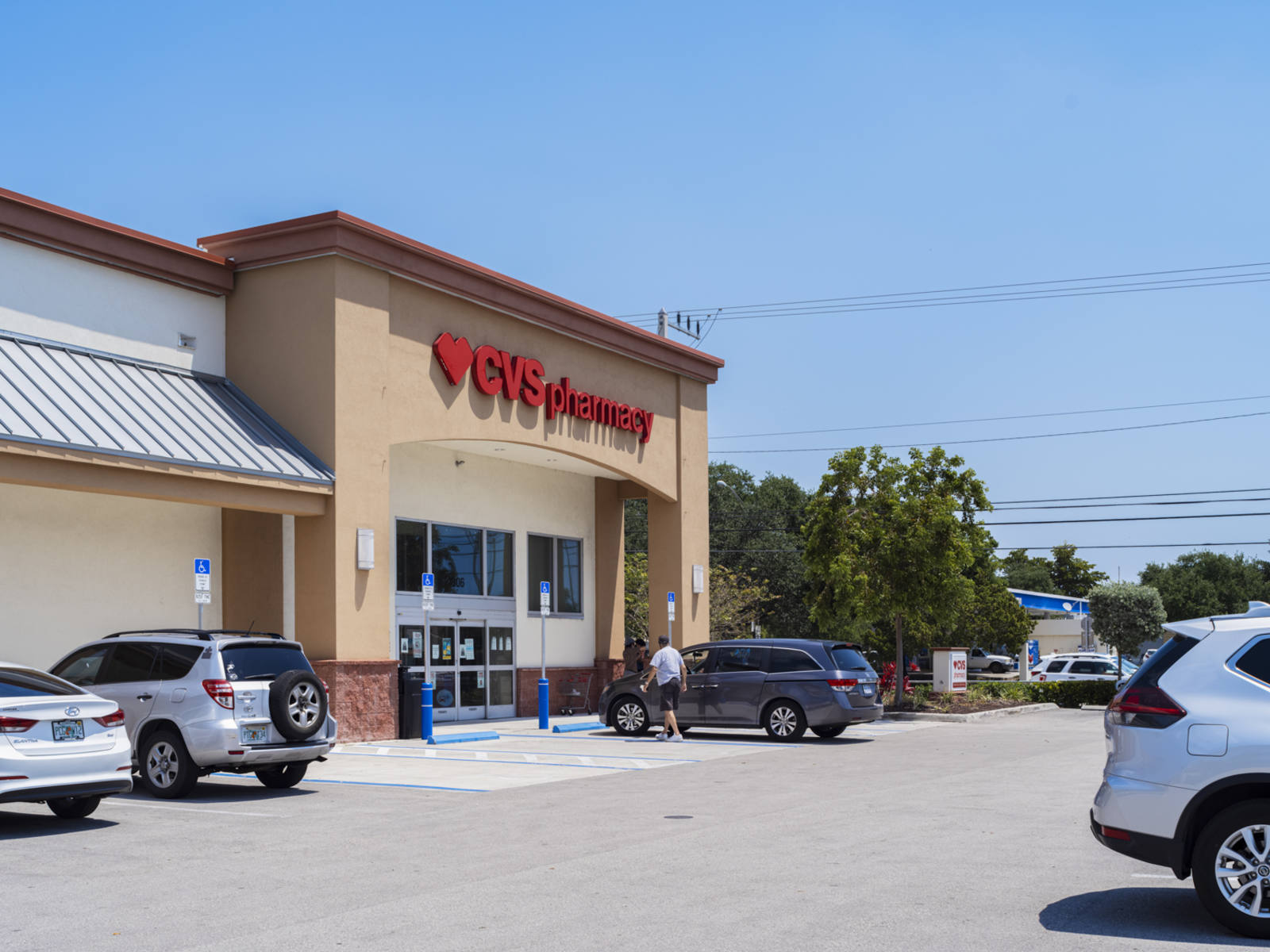 CVS Pharmacy parking lot with trees at Century Plaza Shopping Center