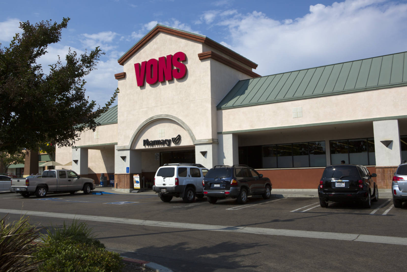 Trees and cars in parking lot for Vons supermarket at Felicita Plaza.