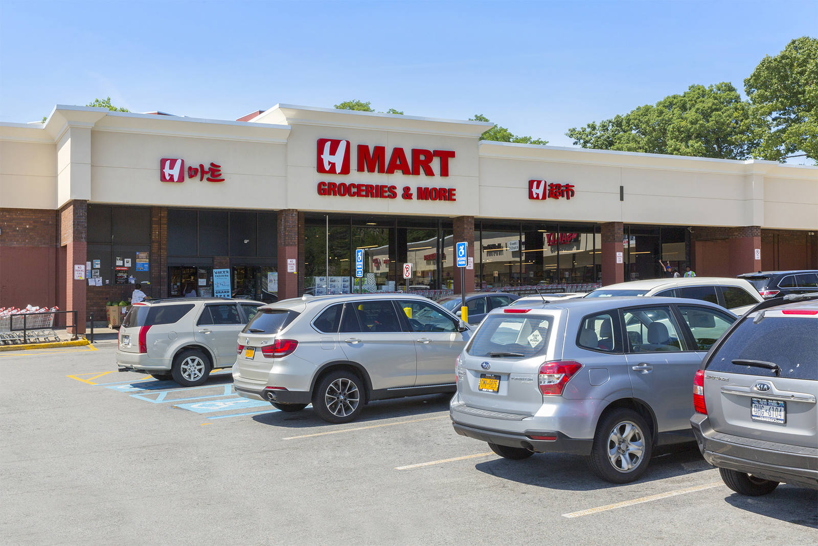 SUVs at Hmart supermarket at Highridge Plaza.