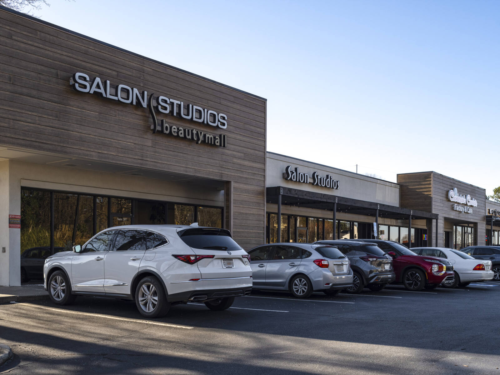 Busy parking lot in front of Salon Studios.