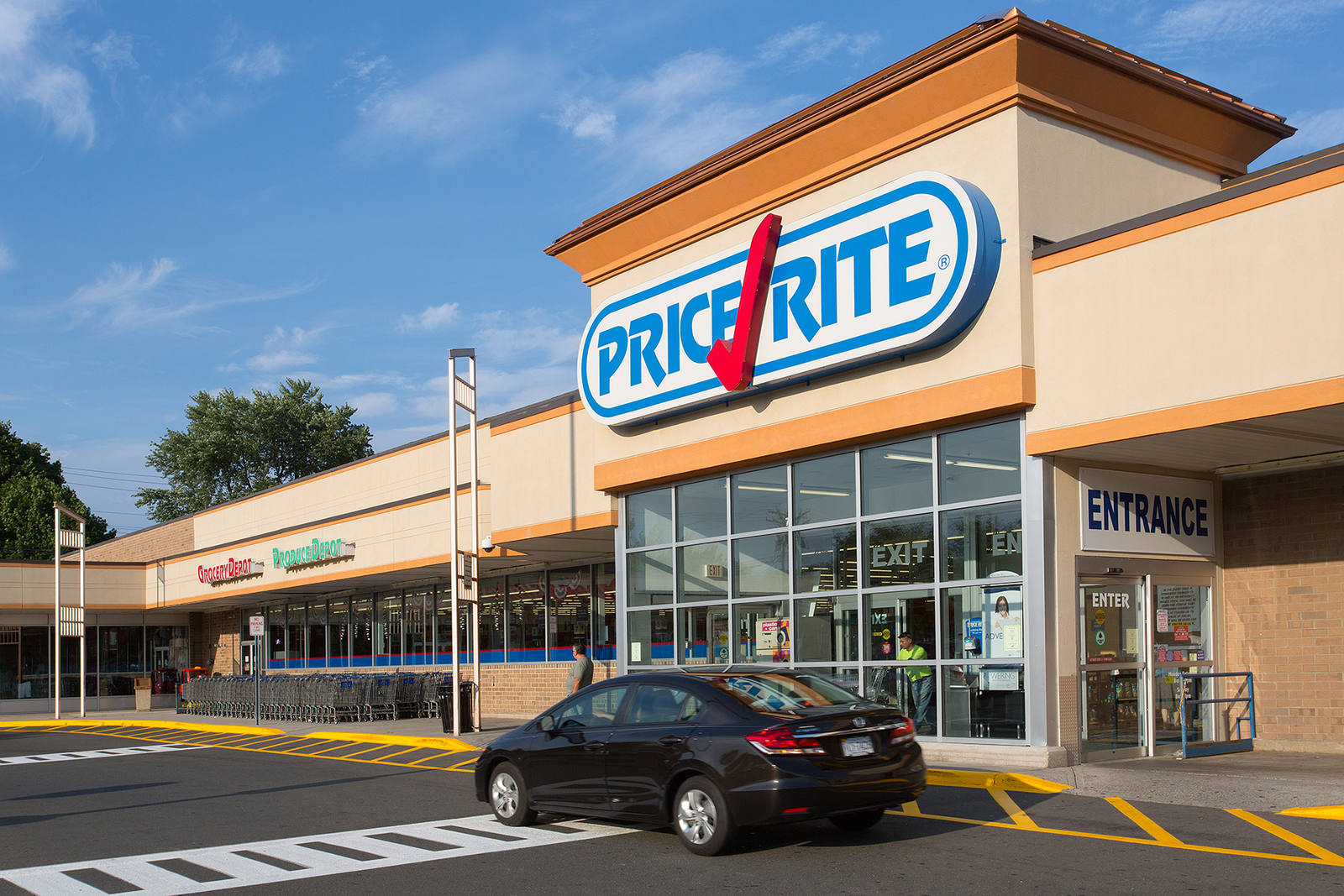 Black car in front of exterior entrance of Price Rite at Parkway Plaza - Hamden shopping center
