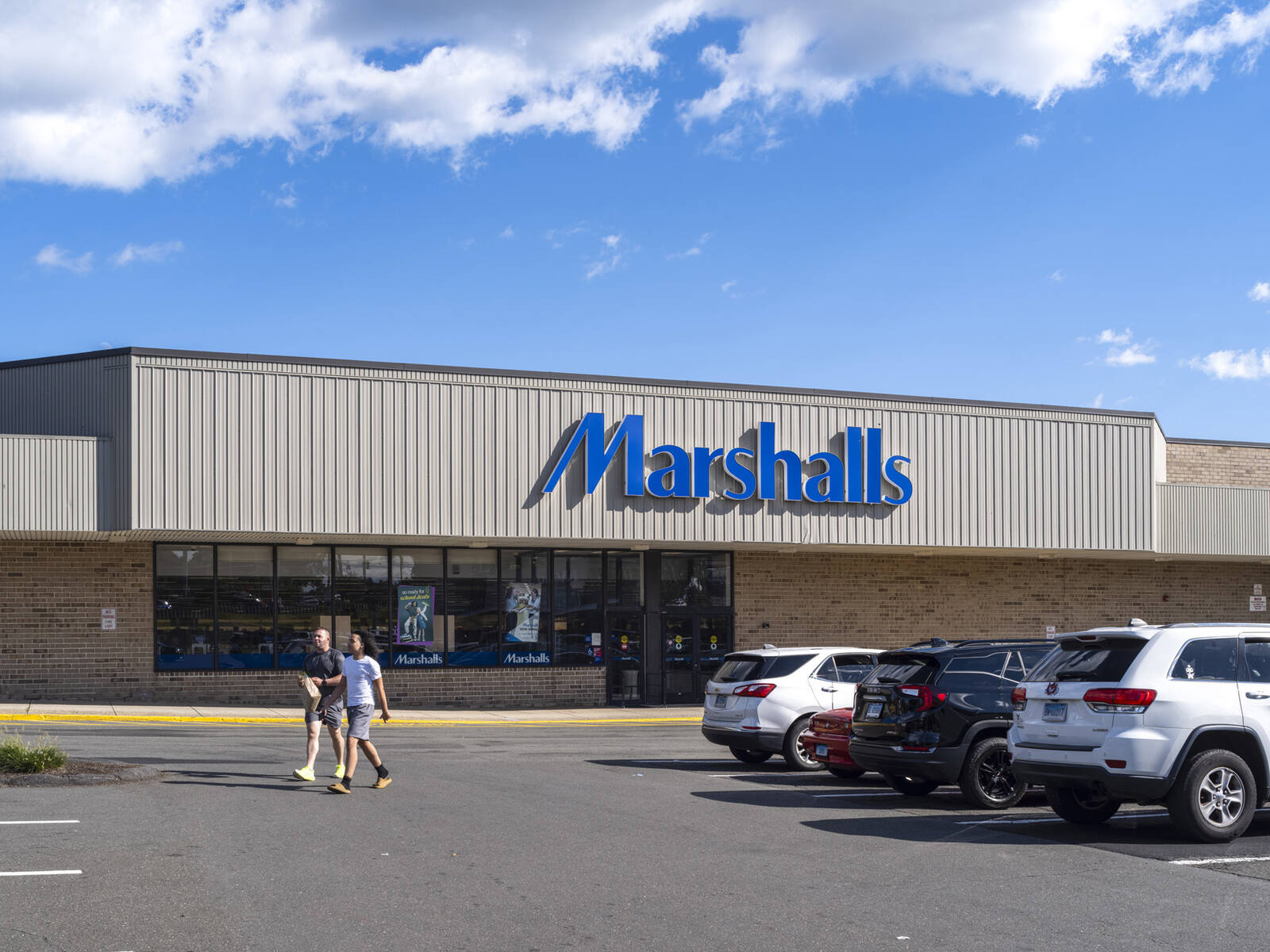 2 men leaving parking lot at Marshalls.