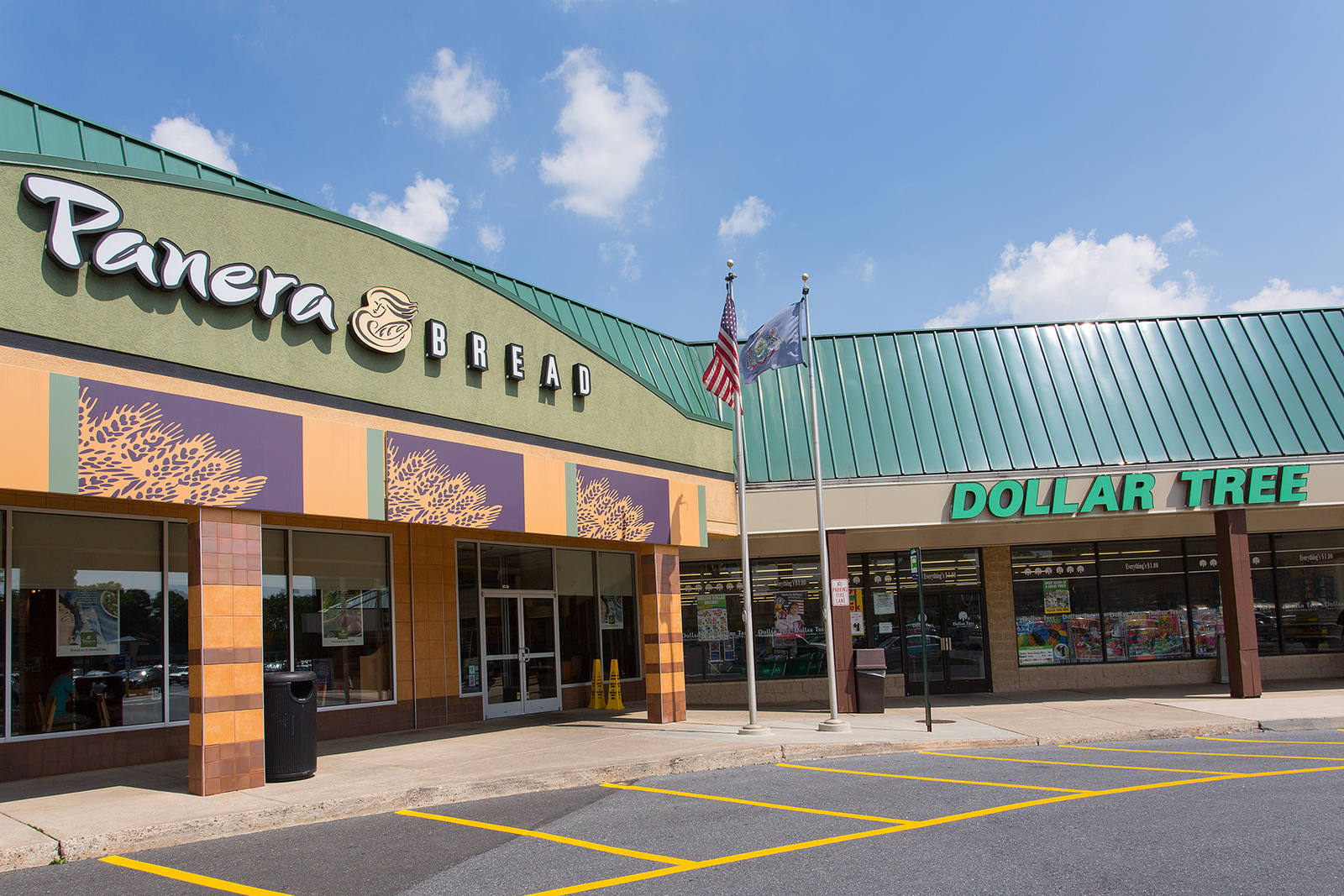 Panera and Dollar Tree entrances at Village West shopping center