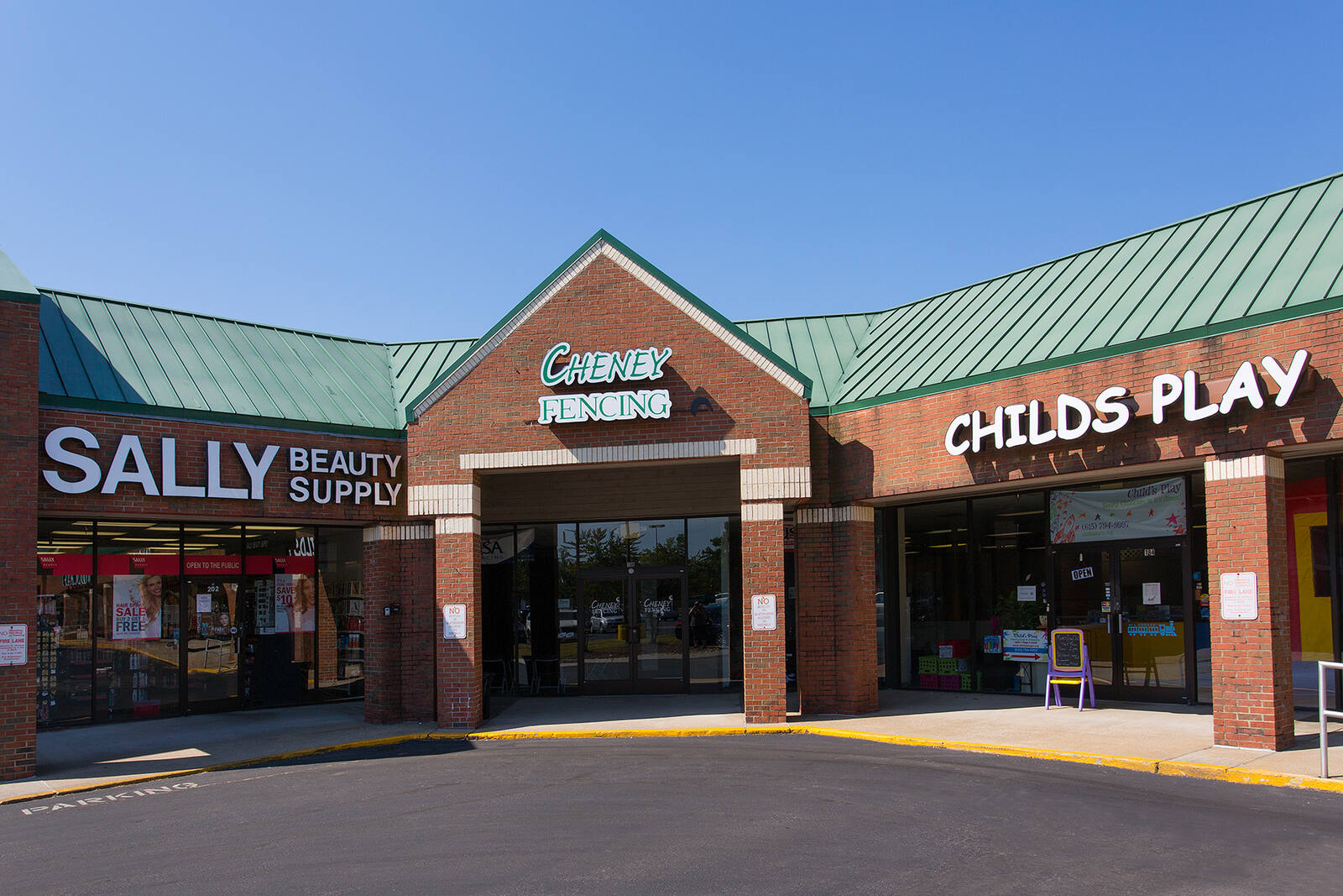 Corner entrance of Watson Glen Shopping Center, Sally Beauty Supply on left side and Childs Play on the right