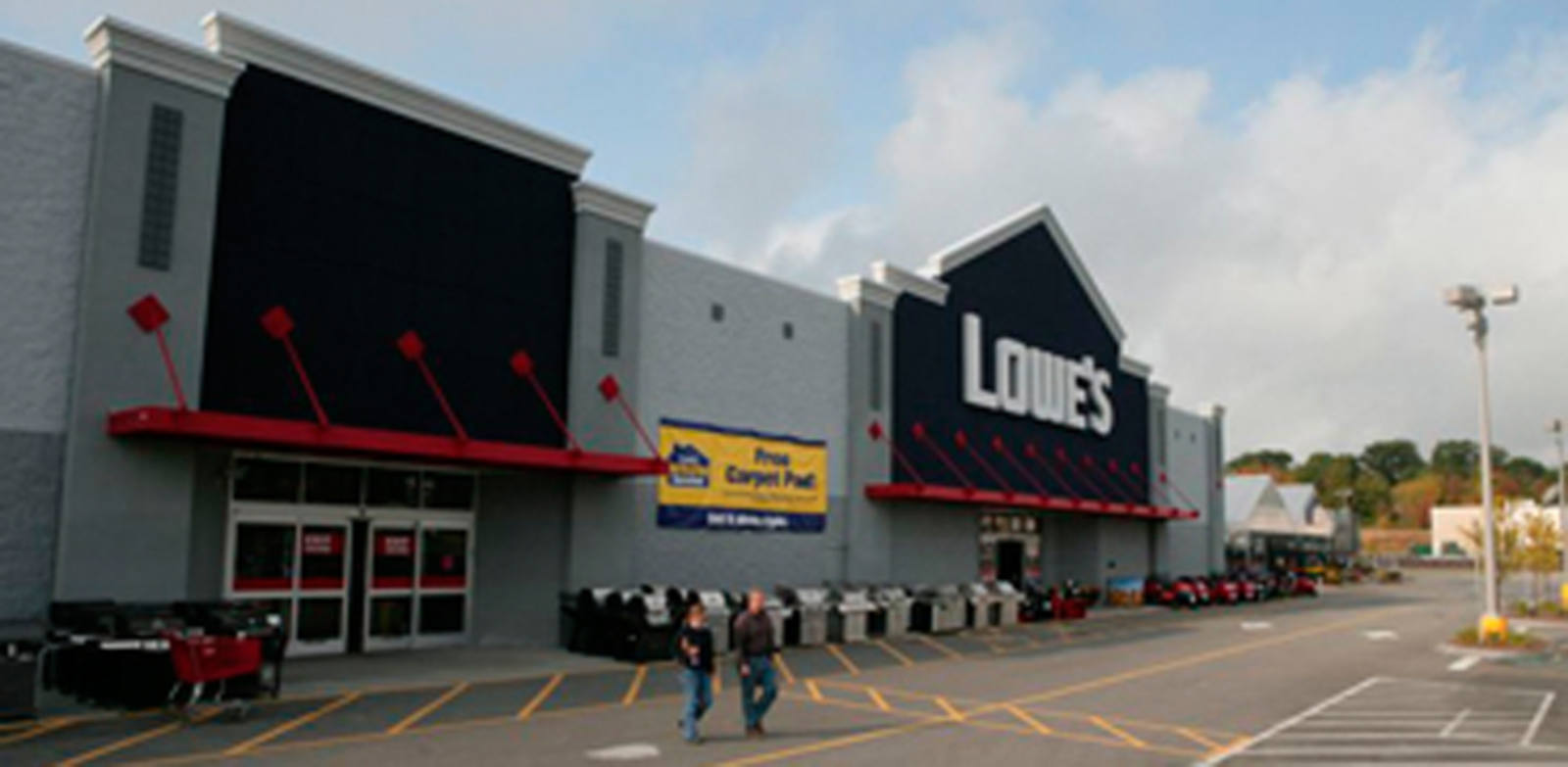 Two customers exiting Lowe's hardware store in Portland, ME.