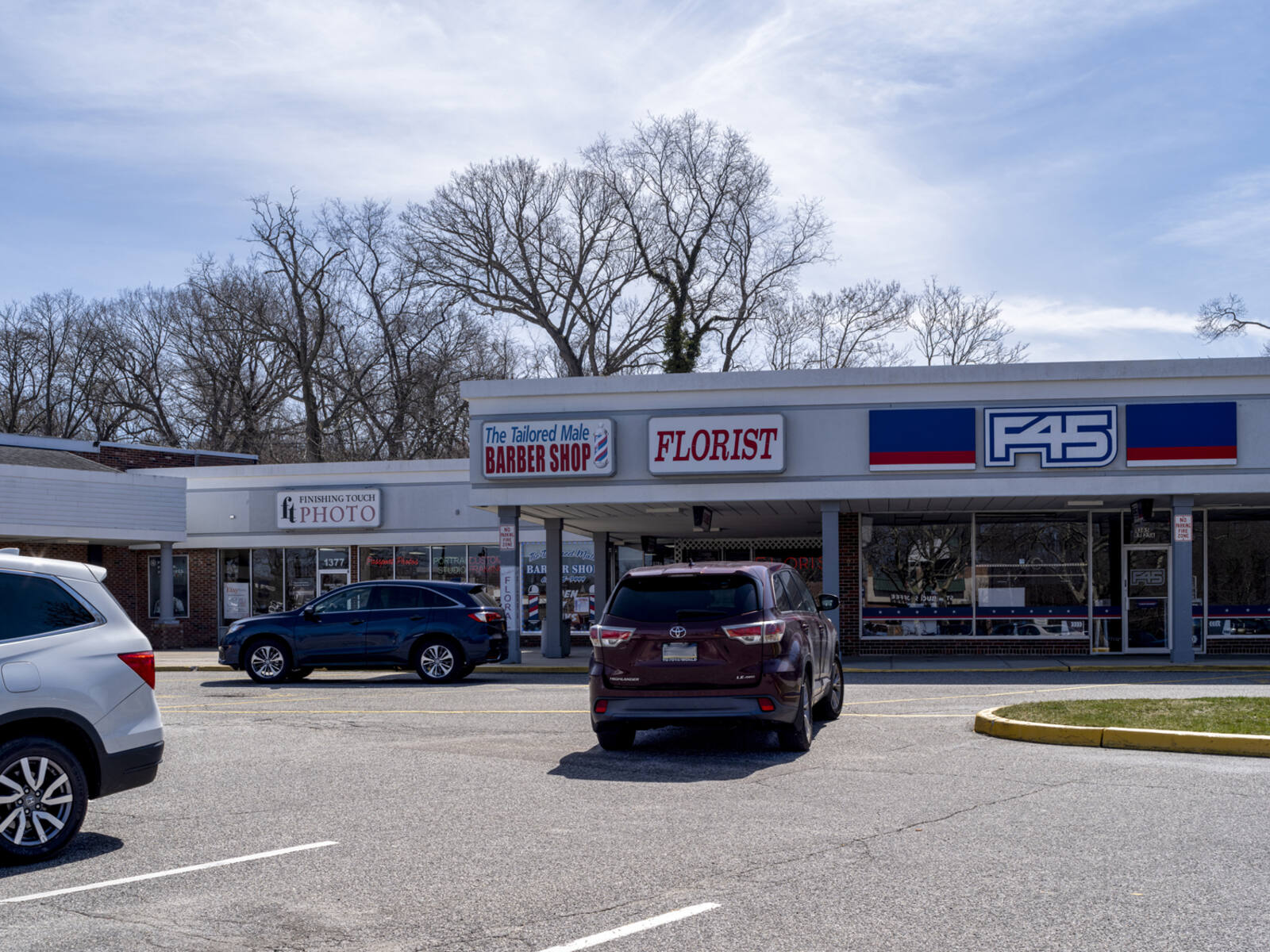 SUV pulls into a parking spot at F45 gym and fitness center.