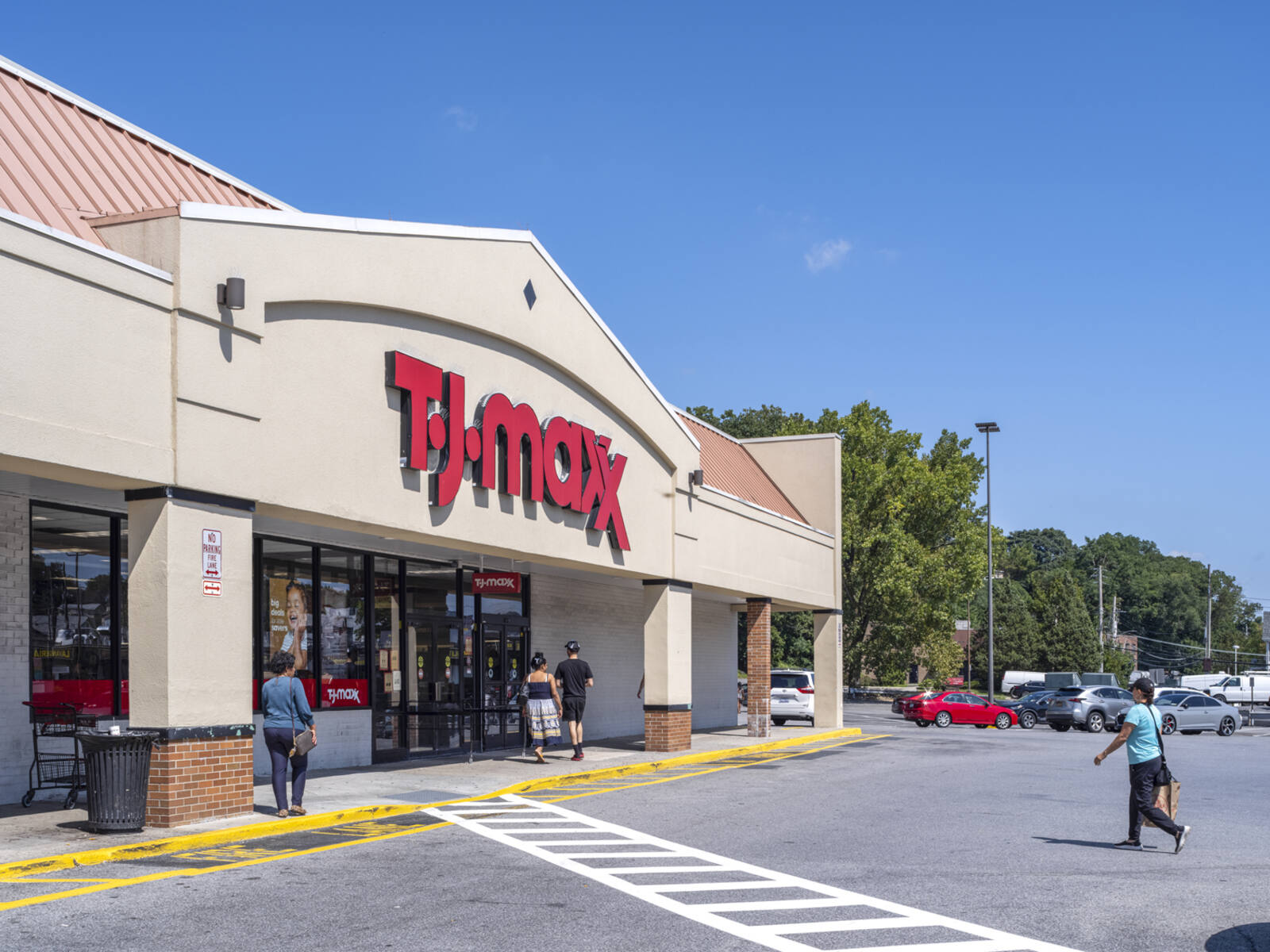 Customers in crosswalk for TJ Maxx.