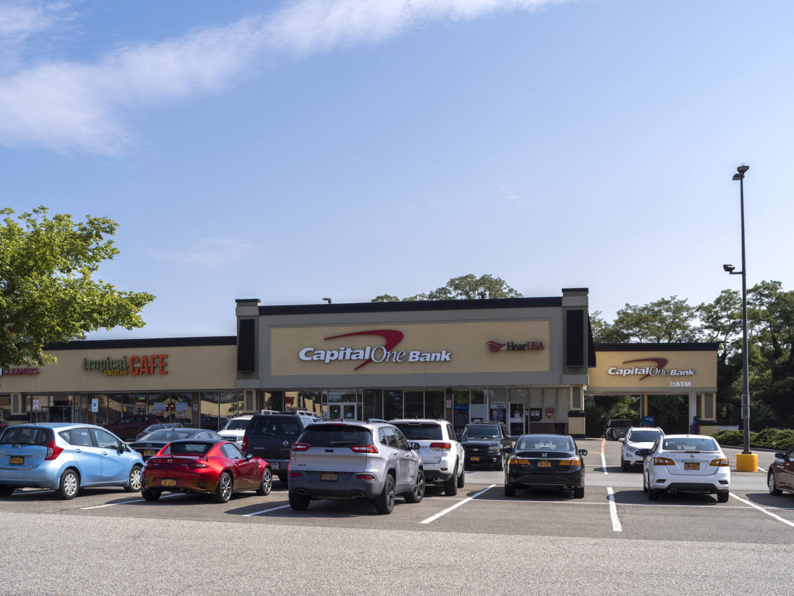 Busy parking lot at Capital One Bank and Tropical Café.