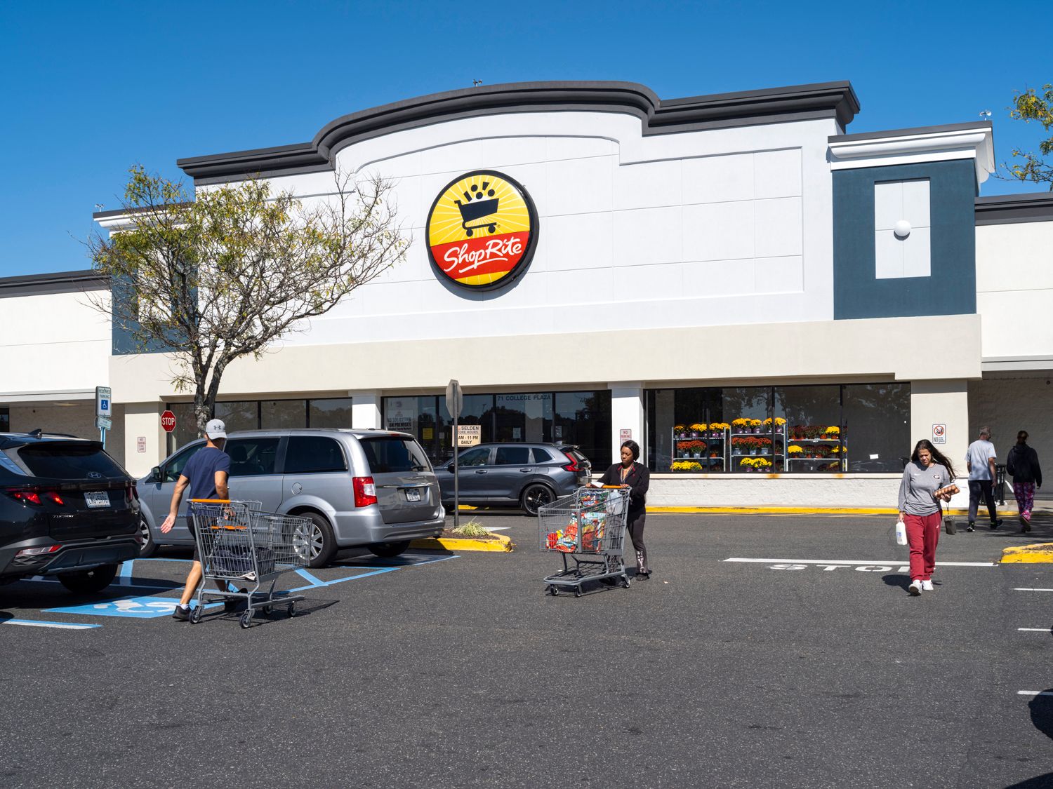 Shoppers with cars in parking lot of ShopRite