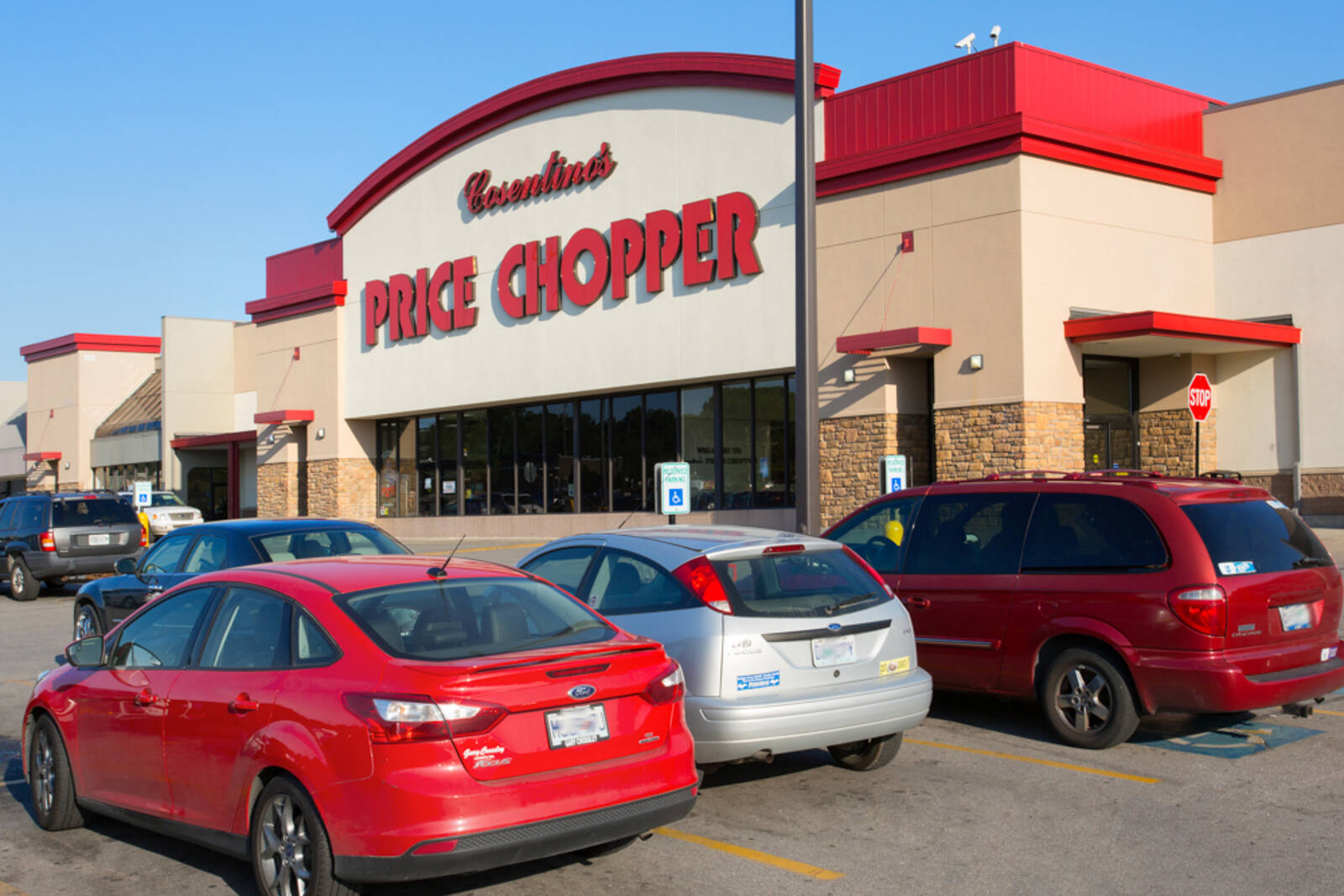 Cars parked in aisle in front of Price Chopper.