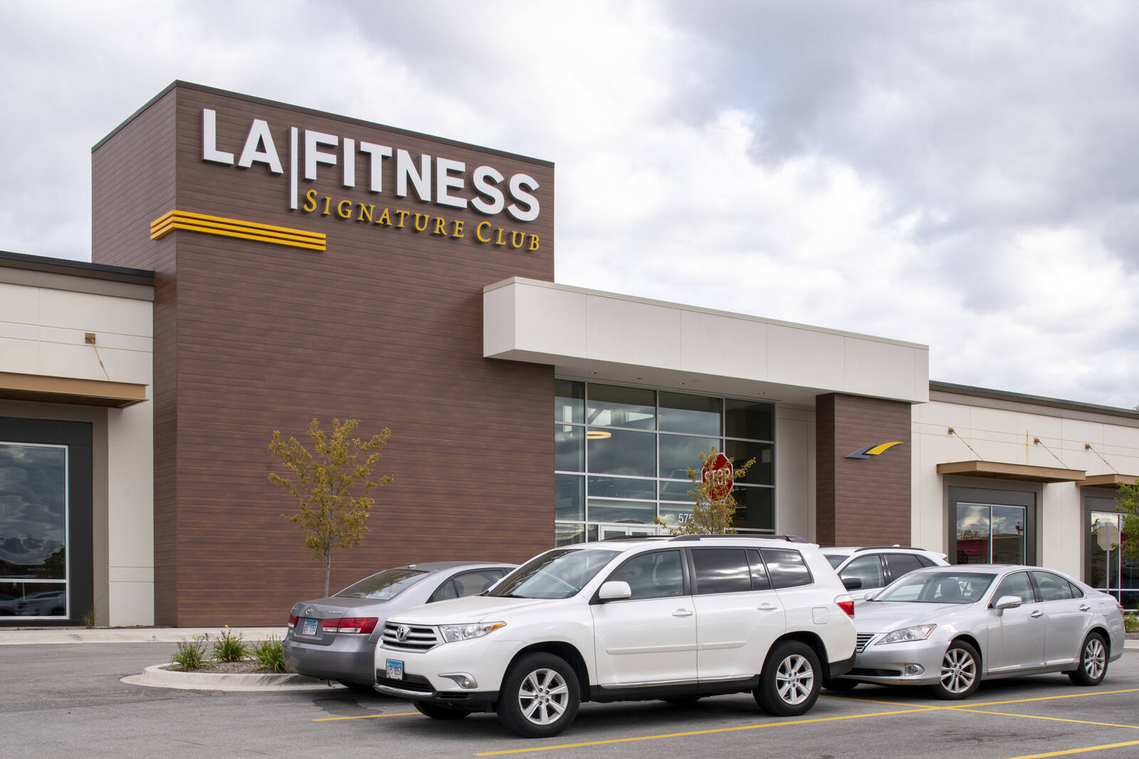 LA Fitness gym with cars in the lot at High Point Centre.