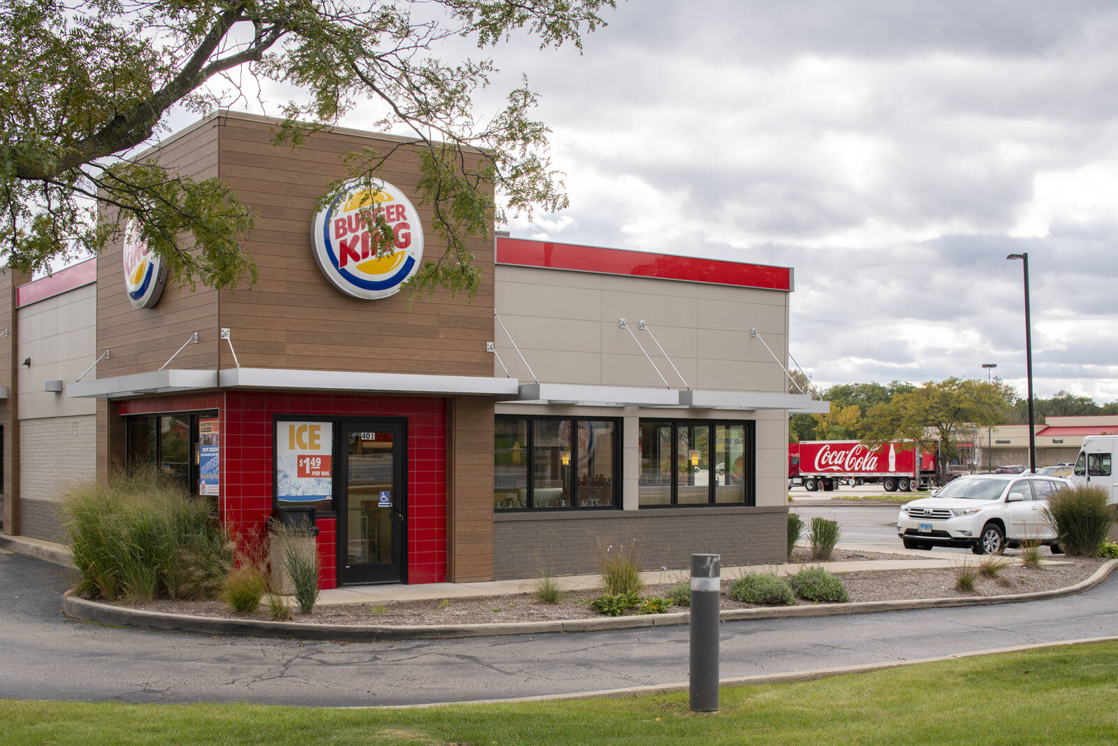 Burger King with car and drive-thru at High Point Centre in Lombard, IL.