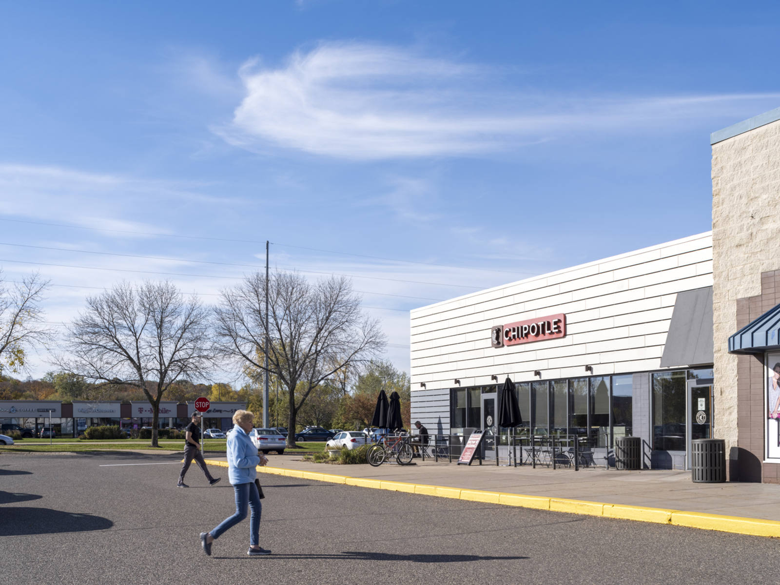 Pedestrians in front of Chipotle restaurant at Westwind Plaza.
