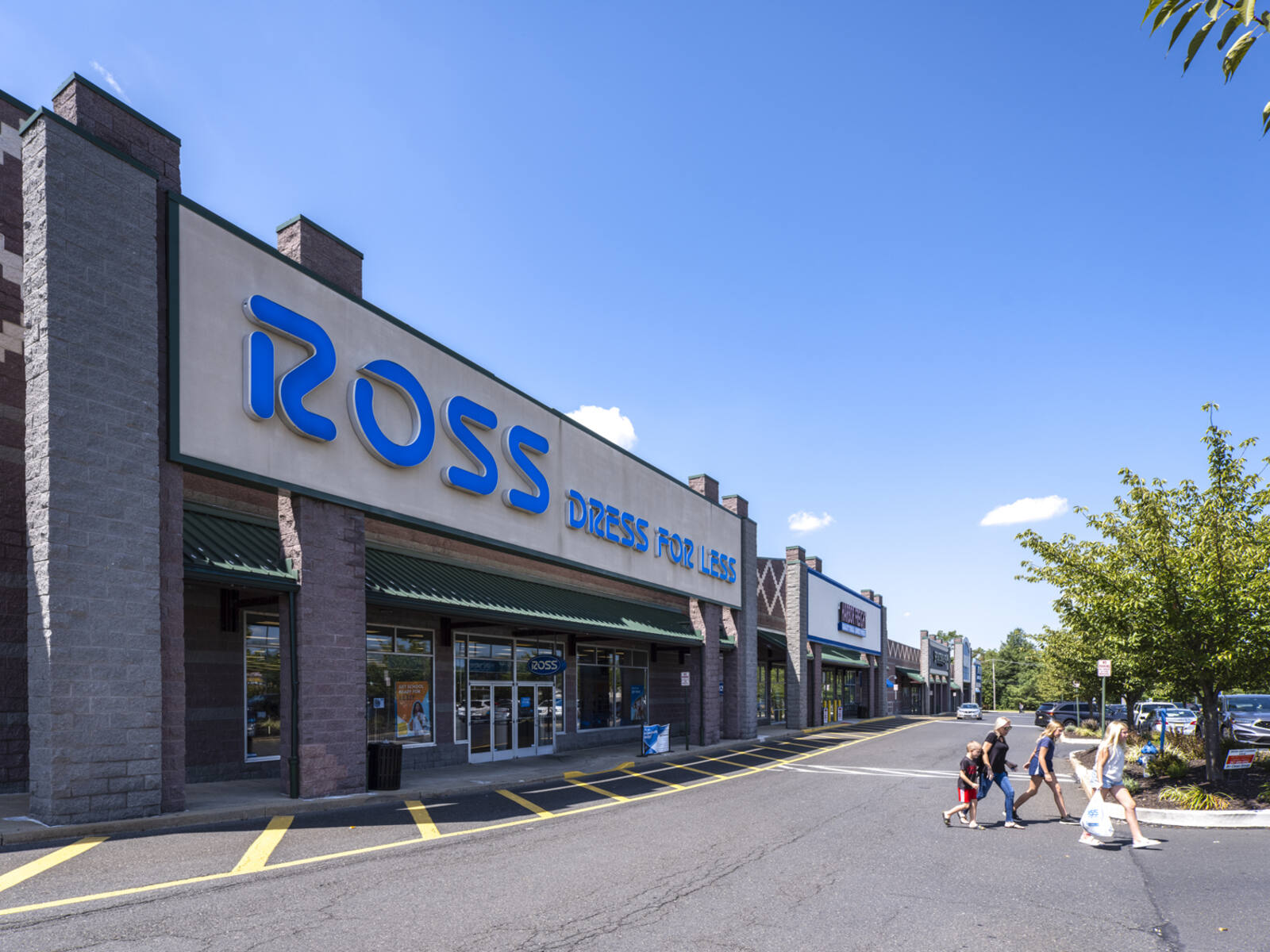 Customers in crosswalk in front of Ross Dress for Less.