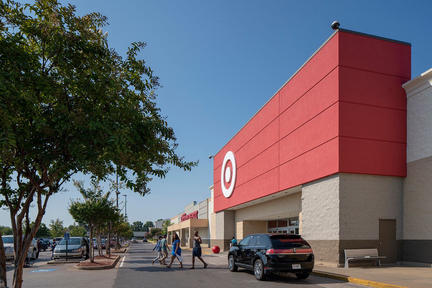 Cars and patrons in crosswalk for Target.