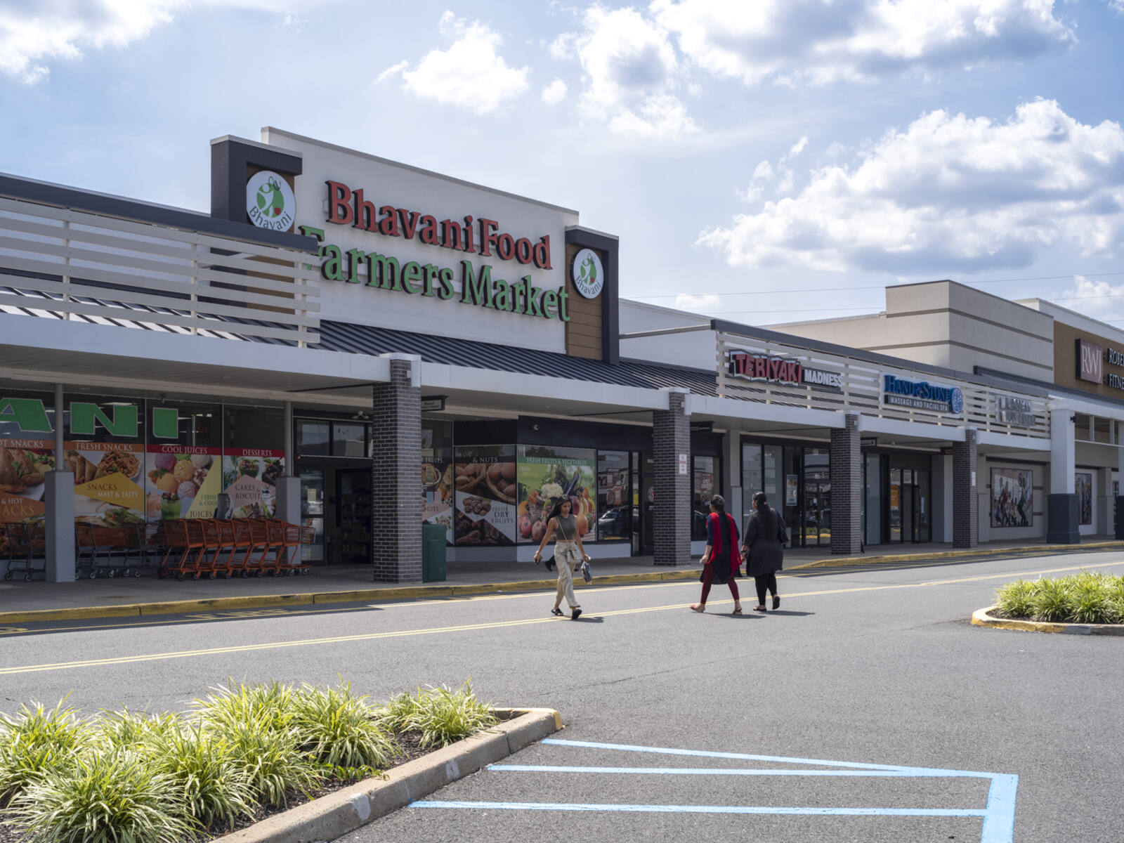 Bhavani Food Farmers Market with group of women in crosswalk.