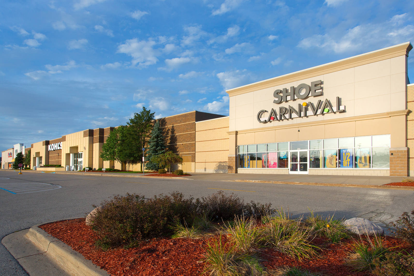 Planters and trees in front of Shoe Carnival in Norton Shores, MI.