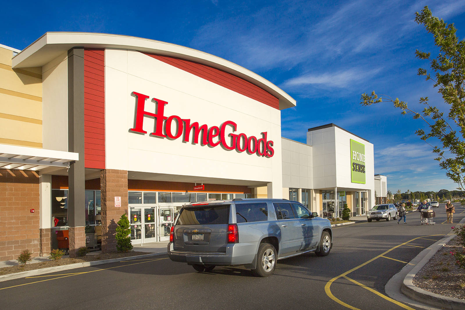 Blue SUV passing by front entrance of HomeGoods